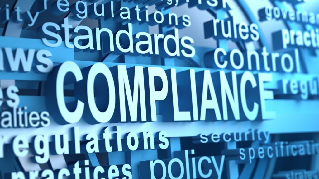 Compliance concept: standards, regulations, and policies in blue blocks on a digital background.