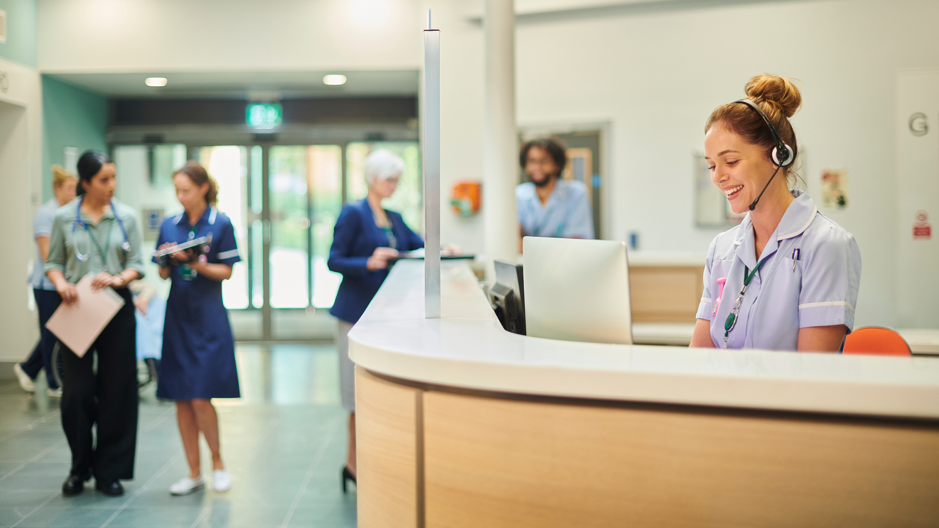 A confident facility manager reviewing a unified aged care dashboard